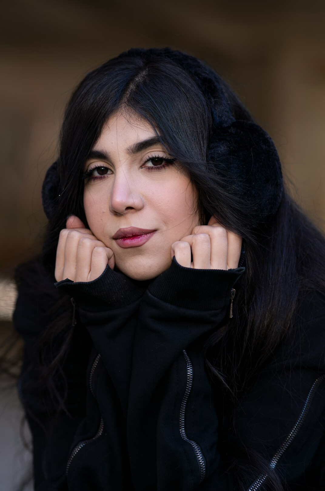 Portrait of a woman with dark hair smiling